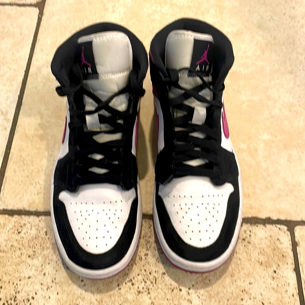 Women’s Nike Air Jordan’s size 8 white/black with purple swoosh and detailing.